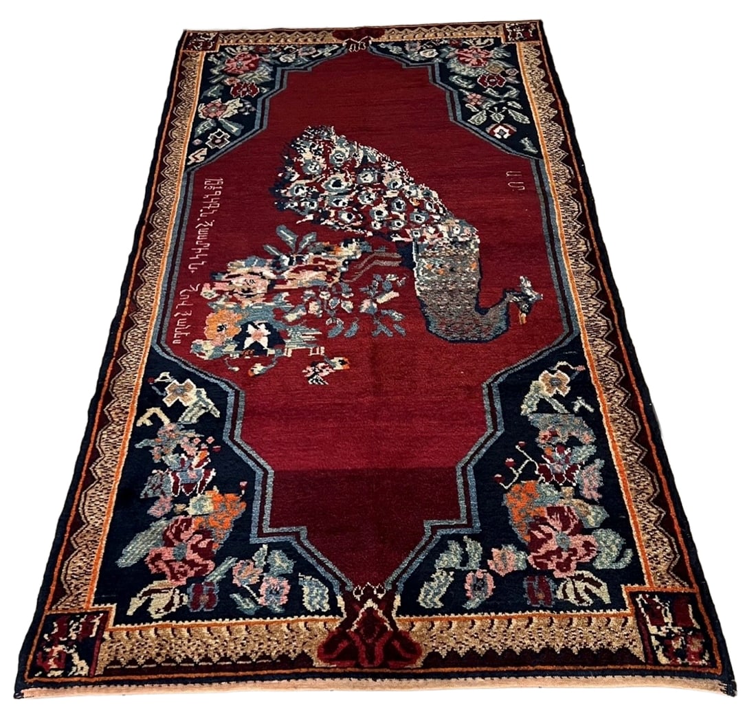 Antique 1924 Armenian Karabagh Pictorial Rug: Antique Armenian Karabagh pictorial rug dated 1924, handwoven in wool and centered with a large peacock perched among flowering branches against a deep red field. The composition features Armenian ins
