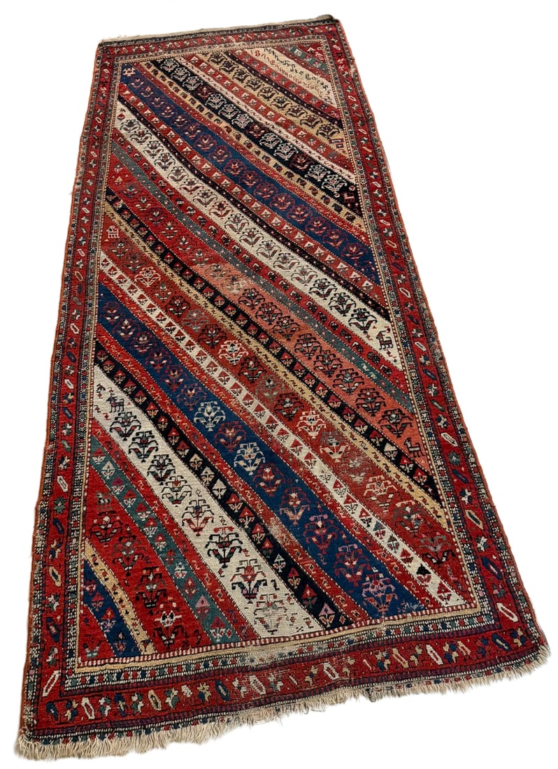 Antique 1871 Armenian Handwoven Rug: Antique Armenian handwoven wool rug dated 1871, featuring diagonal bands filled with stylized floral, geometric, animal, and symbolic motifs. Armenian inscriptions appear within the design, which is r