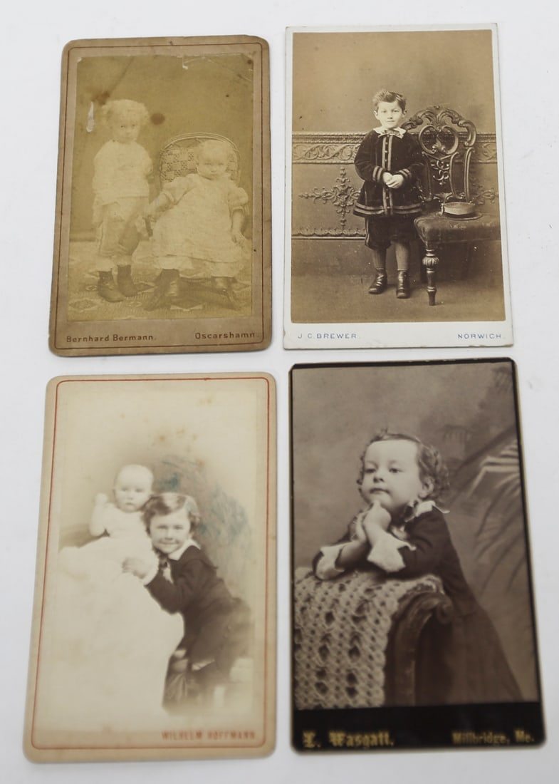Vintage Cabinet Card Photographs of Children Lot of 4: A group of four antique cabinet card photographs depicting children and infants in formal studio portraits. The cards bear photographer imprints from Bernhard Bermann of Oskarshamn, J. C. Brewer of No