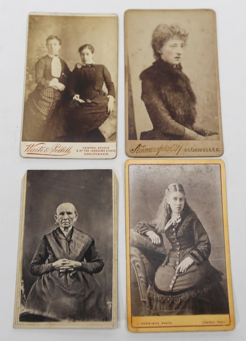 Antique British Cabinet Card Portraits Lot of 4: A collection of four antique cabinet card photographs depicting women in formal Victorian studio portraits, including a portrait of two women, a woman wearing a fur stole, an elderly woman, and a seat