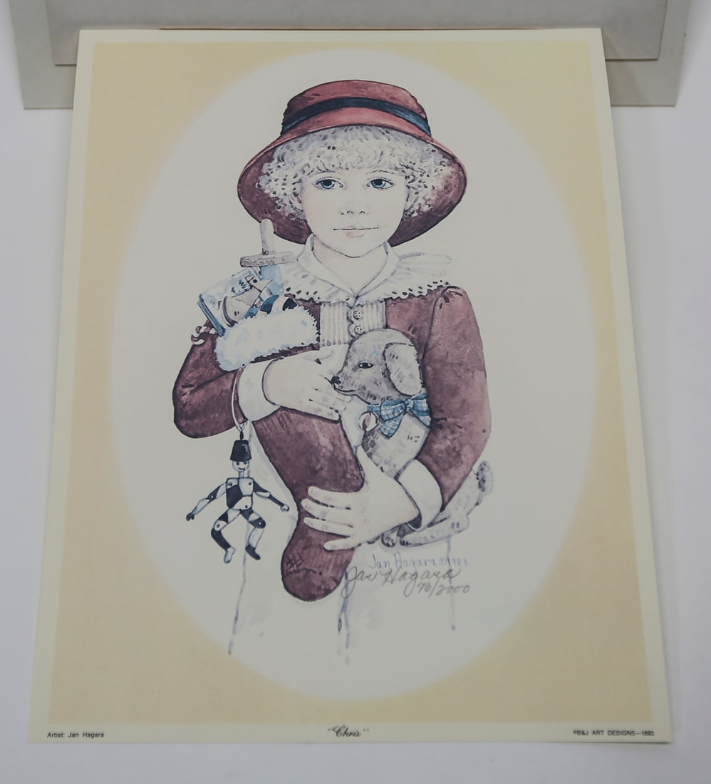 Jan Hagara Chris Limited Edition Lithograph: A limited edition lithograph by Jan Hagara titled Chris, depicting a young child holding a puppy and several vintage toys. Signed and numbered 170 of 2000, dated 1983, and published by B and J Art Des