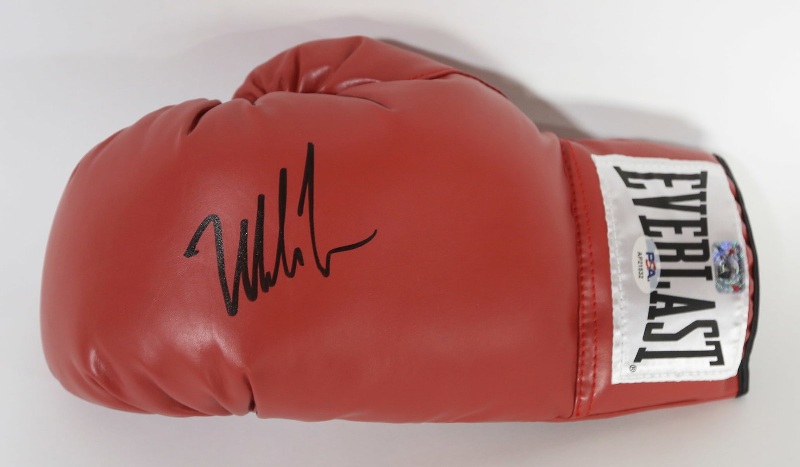 Mike Tyson Signed Red Everlast Boxing Glove PSA Authenticated: Red Everlast left hand boxing glove signed in black marker by legendary heavyweight boxing champion Mike Tyson. Bearing a PSA authentication hologram numbered AP21532. A desirable piece of boxing and