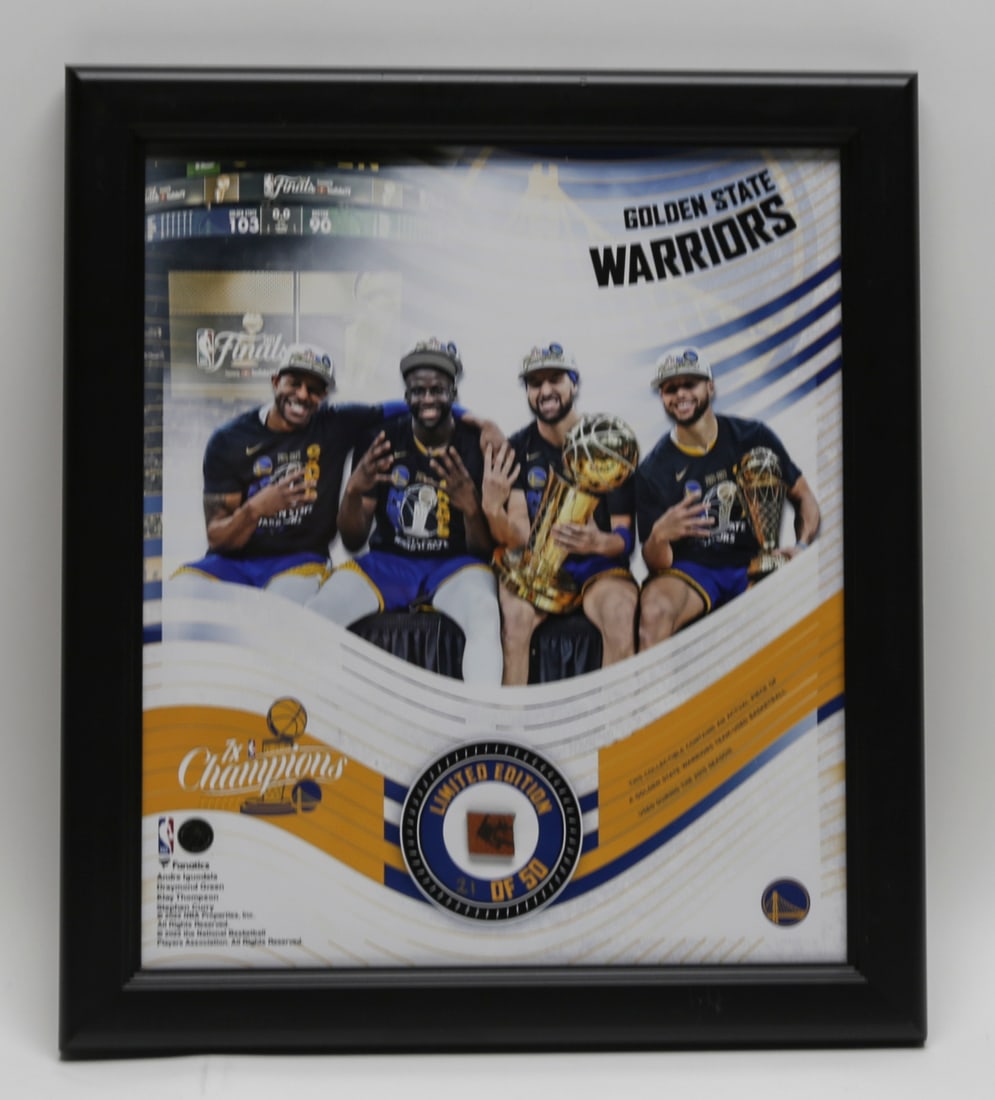 Golden State Warriors Championship Basketball Display: Framed Golden State Warriors championship commemorative display featuring members of the team posed with championship trophies and an inset fragment from a team used basketball from the historic 2015 