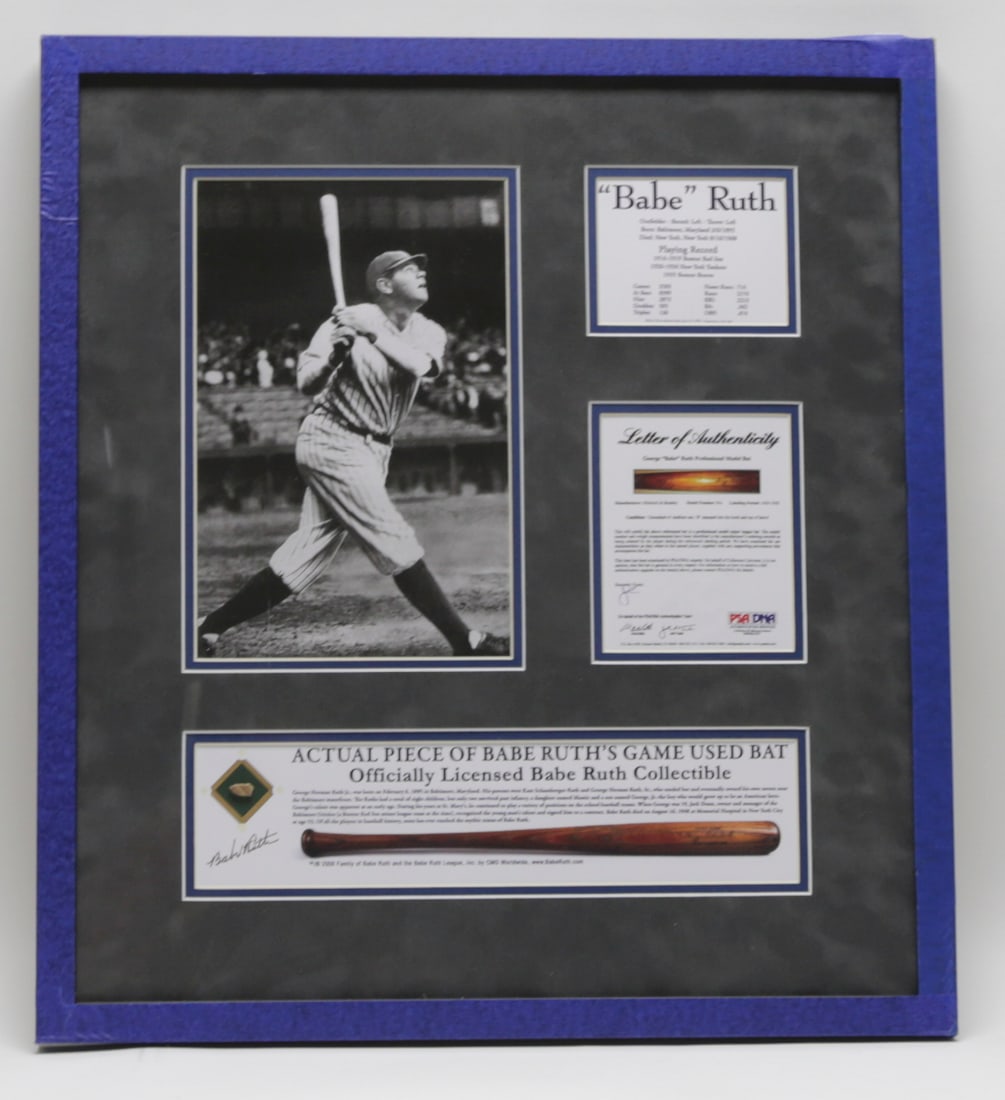 Babe Ruth Game Used Bat Fragment Display: Framed Babe Ruth baseball commemorative display featuring a large black and white batting photograph, career statistics, an inset fragment identified as an actual piece of a Babe Ruth game used bat,
