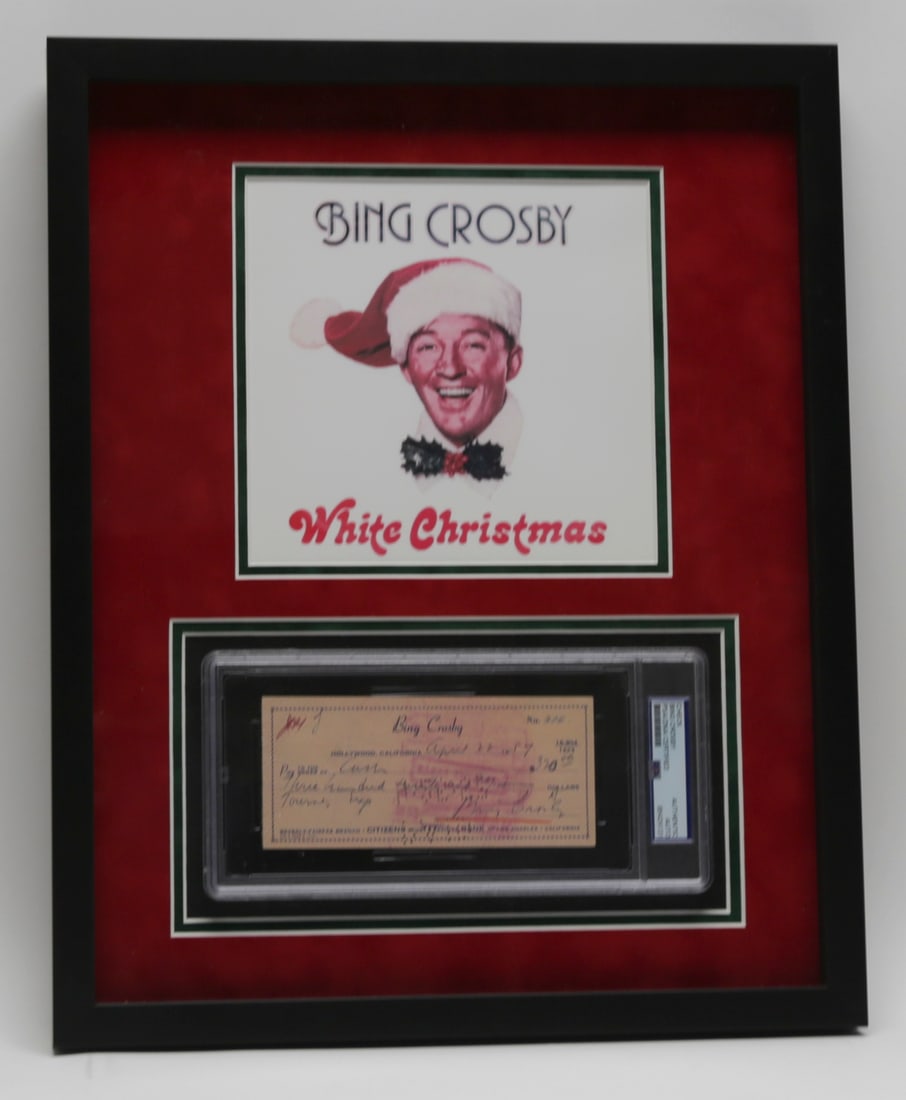 Bing Crosby Signed Check PSA DNA Certified: Framed Bing Crosby memorabilia display featuring a vintage bank check dated April 22 1957 and signed by Crosby, accompanied by PSA DNA certification number 85424131. The check is displayed beneath an 