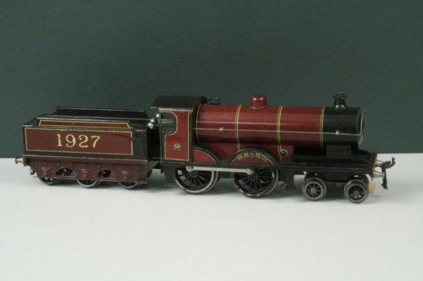 Bing for Bassett Lowke 4-4-0 locomotive and tender,: Bing for Bassett Lowke 4-4-0 locomotive and tender, 'Duke of York', no. 1927, lithographed in LMS maroon livery, 15in.