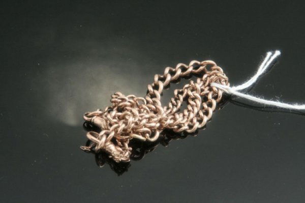 A pair of curb link bracelets: A pair of curb link bracelets, with clip clasps, approximately 23 grams total