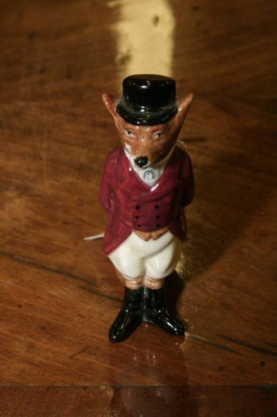 A Royal Doulton figure of a fox in hunting costume: A Royal Doulton figure of a fox in hunting costume, 4.5ins