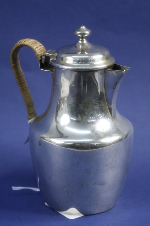 An Edwardian silver hot water pot, 6.25ins: An Edwardian silver hot water pot, of shouldered form with cane bound handle, Charles Stuart Harris, London 1904, 6.25ins