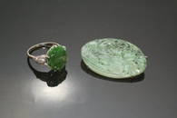 2377: A carved jade dress ring and similar brooch