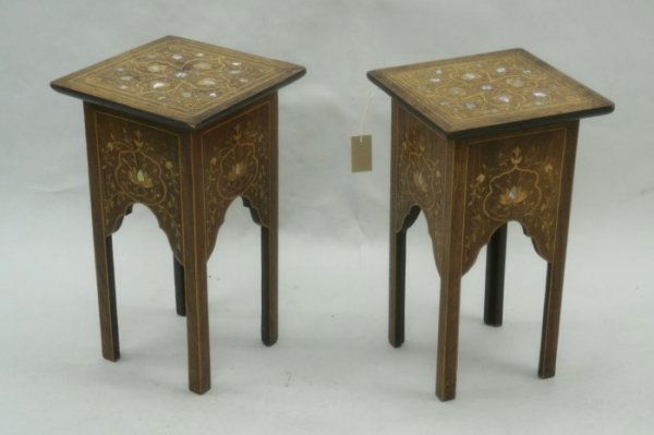 A near pair of Indian rosewood tea tables, height: A near pair of Indian rosewood tea tables, with foliate boxwood and mother of pearl inlaid decoration, bears retailers label Walsh & Co, height 1ft 2ins,width 11.5ins