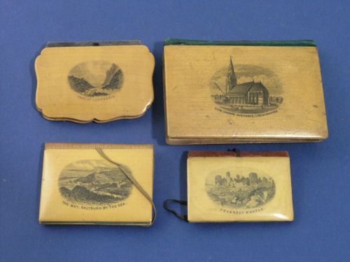 Three Mauchlineware needle cases and a miniature b: Three Mauchlinware needle cases, decorated with views of Pevensey Castle, the pass of Llanberis and a double sided example of Saltburn by the Sea; and a miniature book decorated with New Church, Skegn