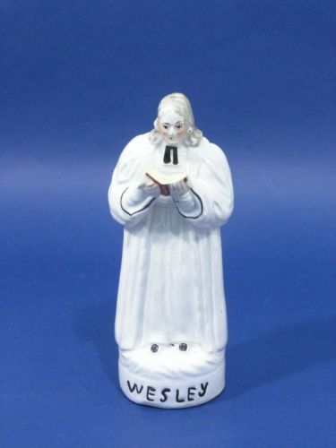 A Victorian Staffordshire figure of John Wesley, 7: A Victorian Staffordshire figure of John Wesley, reading from bible, 7in.