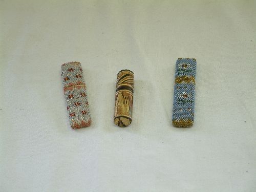Two Victorian glass beaded needle cases: Two Victorian glass beaded needle cases and a straw work Prisoner of War needle case