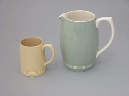 A Keith Murray pint tankard, with banded design,: A Keith Murray pint tankard for Wedgwood with banded design, and a Wedgwood Keith Murray jug, with green glaze and banded design, H 12cm and 20.5cm