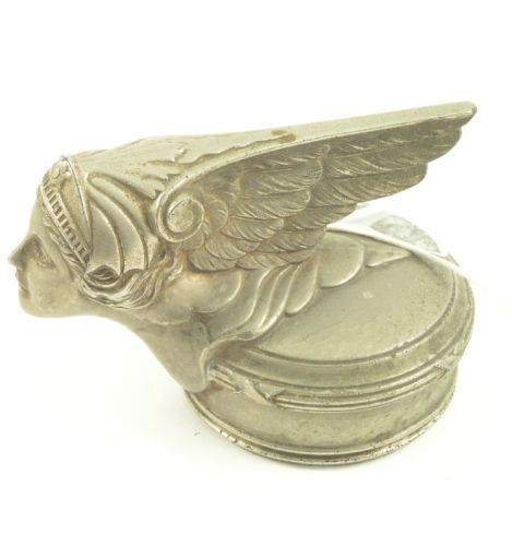 A Minerva car radiator cap mascot, 4.5ins: A Minerva car radiator cap mascot, modelled with a projecting winged head of a lady, on circular cap, 4.5ins