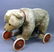 26: A Steiff Teddy bear on wheels, 26in. long