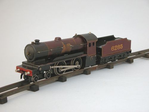 A Bassett-Lowke live steam locomotive and tender;: A Bassett-Lowke live steam locomotive and tender, in dark maroon and gilt livery, No 6285, boxed; and a quantity of associated track (some faults).