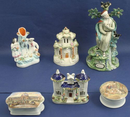 A Staffordshire figure, 'Elijah', three other Staf: A Staffordshire figure, 'Elijah', seated beside two ravens (11.25in. - some damage), together with a Staffordshire cottage pastille burner, cottage model, spill vase and two Victorian pot-lids, one en