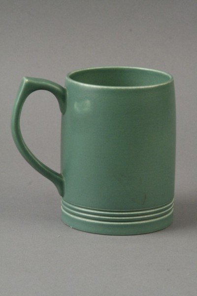 A Keith Murray mug, 5in.: A Keith Murray mug, glazed in green monochrome, printed mark, 5in.