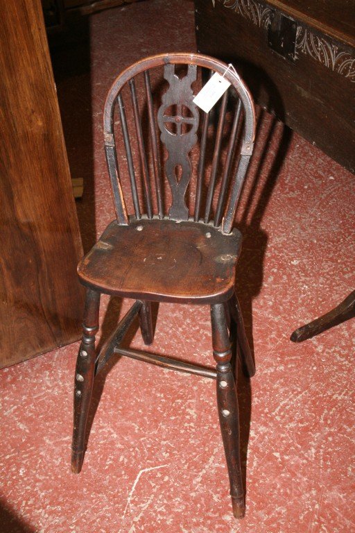 An early 19th century child's wheelback high chai