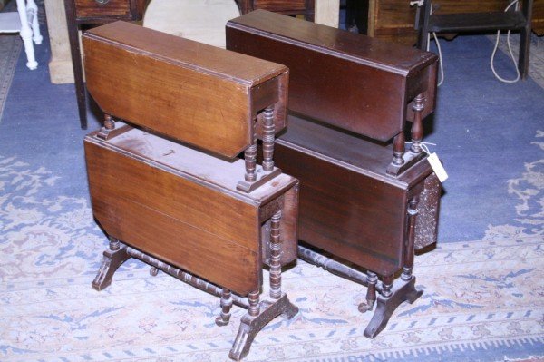An Edwardian mahogany two tier Sutherland table, 