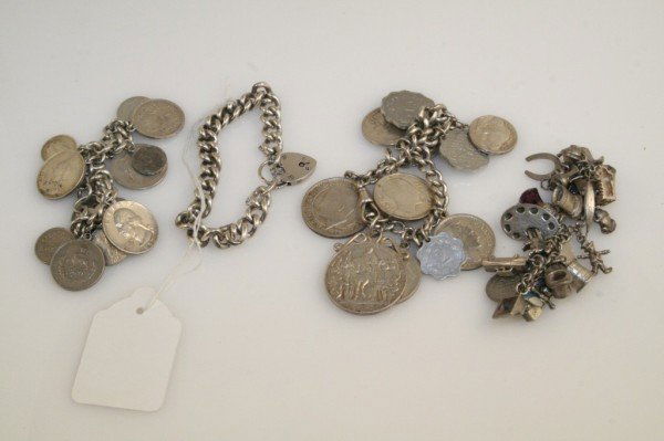 3 curb link bracelets & a charm bracelet: A silver curb link bracelet, two silver curb link bracelets hung various coins and a silver charm bracelet, approximately 265 grams total