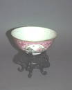 594: A Chinese famille rose porcelain bowl on hardwood 