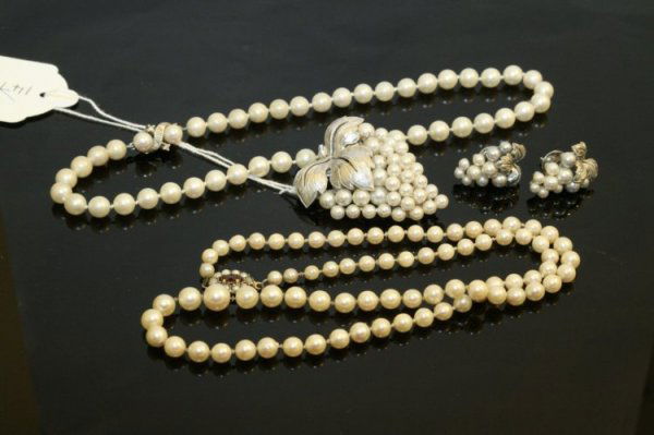 A cultured pearl choker necklace and pair of matc: A cultured pearl choker necklace, together with a graduated string of cultured pearls, a cultured pearl clip designed as a bunch of grapes, stamped 18k, and a pair of matching earrings.