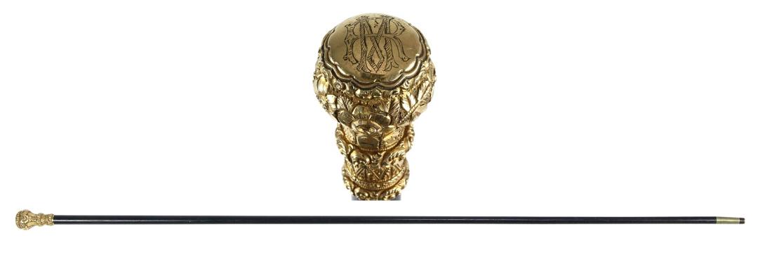 Gold-Filled Gentleman's Cane: An elegant 19th Century, gold-fillled gentleman's walking stick with ebony wood shaft, makers Hallmarks stamped on ornate gold-filled knob. Condition: B (Please see our "Auction Terms and Info" for a