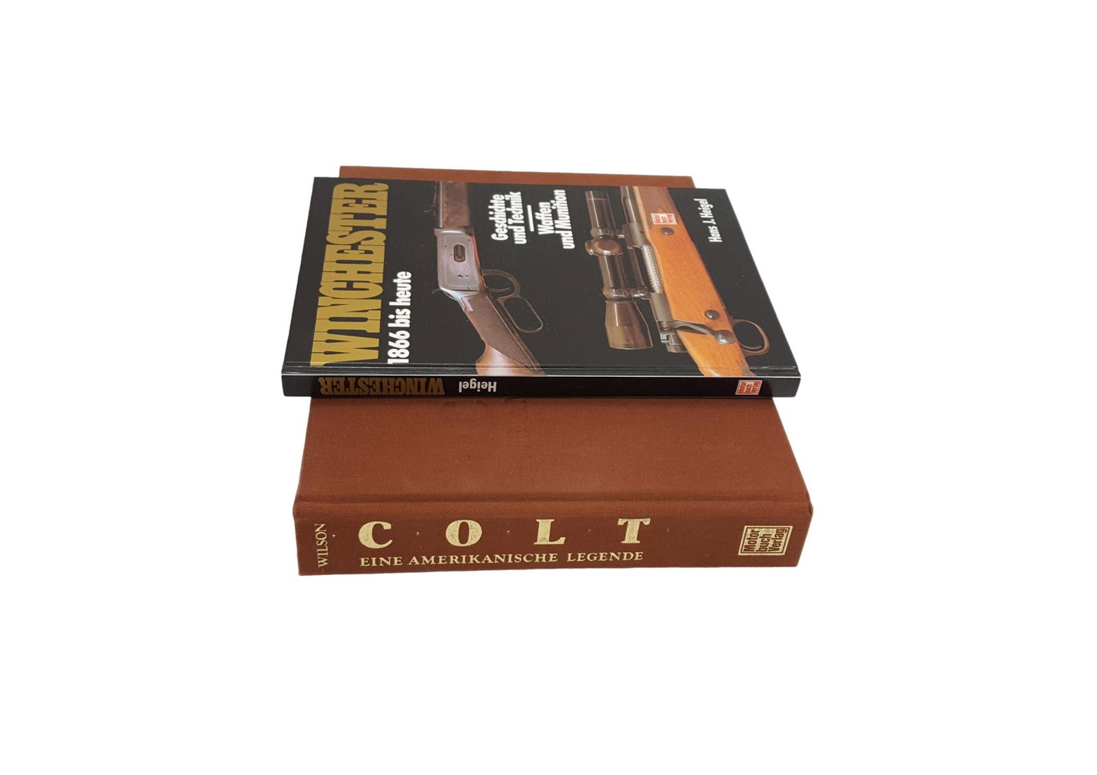 Lot of 2 Books (in German) on Colt and Winchester Firearms: Lot of 2 Books (in German) on Colt and Winchester Firearms, comprising "Colt - Eine Amerikanische Legende" by R.L. Wilson; and "Winchester - 1866 bis heute" by Hans Heigel. Although printed in German,