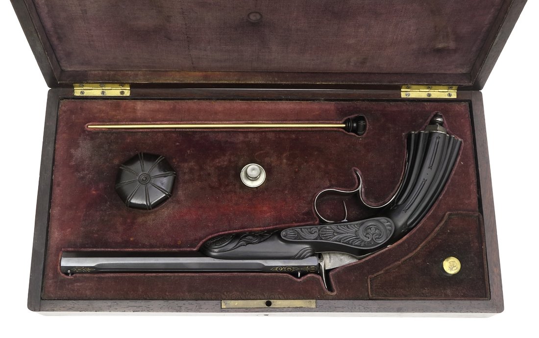 Cased Target Pistol, Belgian ca. 1860, cal. .22: Scheibenpistole, belgisch, um 1860, Kal. .22 Flobert, #8771, im Kasten, bruenierter Oktogonallauf, oben mit Zierkehlungen, Kal..22, Oberseite in Goldtausia sig. "P. MALHERBE A LIEGE", Rankentausia in 
