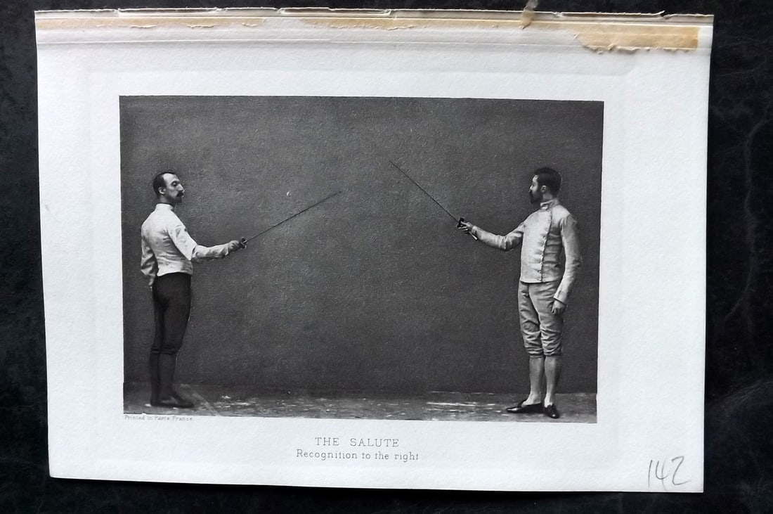 Badminton Library 1907 Antique Sword Fencing Print. The Salute. Recognition to the right.: Photogravure Published 1907, London for "The Badminton Library of Sports and Pastimes..." by Walter H. Pollock, E. B. Michell, and Walter Armstrong.Paper Size: 7.5 x 5 inch (19 x 13cm) Good Condition