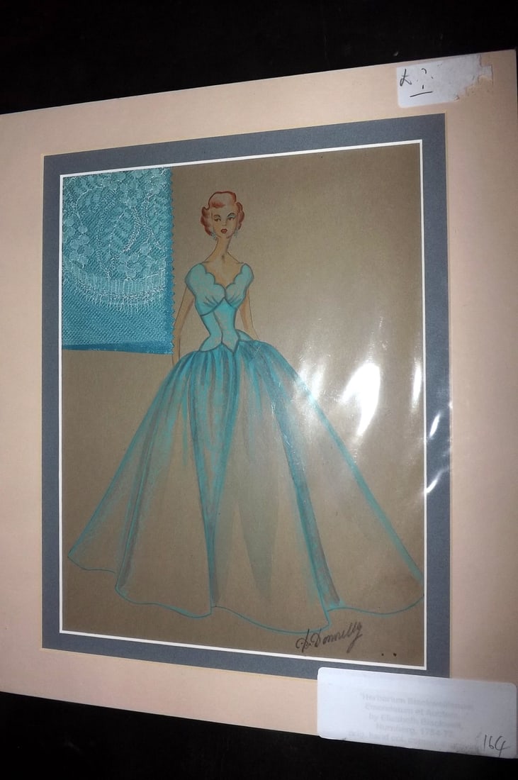 Original Art 1950's Fashion Design and Swatch of Cloth relating to the Dress. D. Donnelly: Watercolour & Goauche signed D. Donnelly. Fashion design with accompanying Swatch of cloth. Mounted/Matted. Overall Size: 14 x 12 inch (36 x 30cm) Good Condition