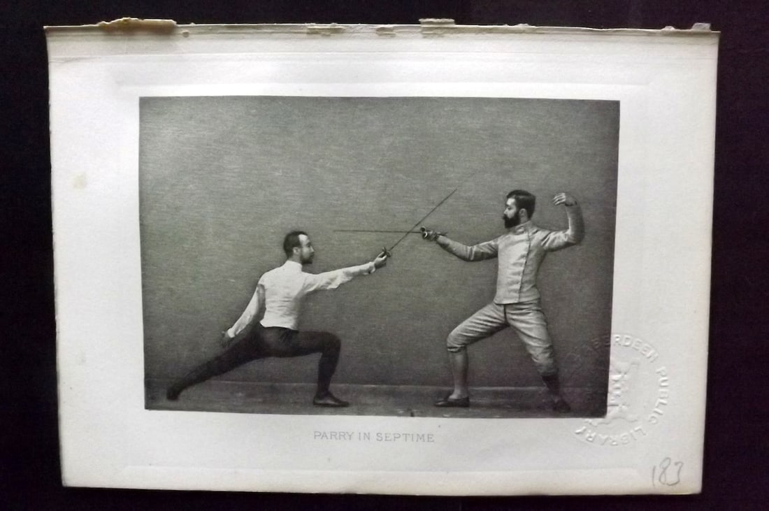 Badminton Library 1889 Antique Sword Fencing Print. Parry in Septime.: Photogravure Published 1889, London for "The Badminton Library of Sports and Pastimes..." by Walter H. Pollock, E. B. Michell, and Walter Armstrong.Paper Size: 7.5 x 5 inch (19 x 13cm) Discrete Librar