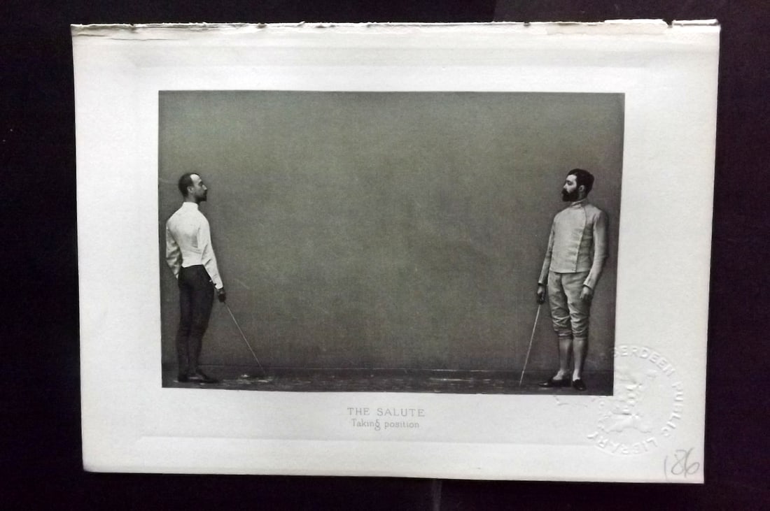 Badminton Library 1889 Antique Sword Fencing Print. The Slaute. Taking Position.: Photogravure Published 1889, London for "The Badminton Library of Sports and Pastimes..." by Walter H. Pollock, E. B. Michell, and Walter Armstrong.Paper Size: 7.5 x 5 inch (19 x 13cm) Discrete Librar