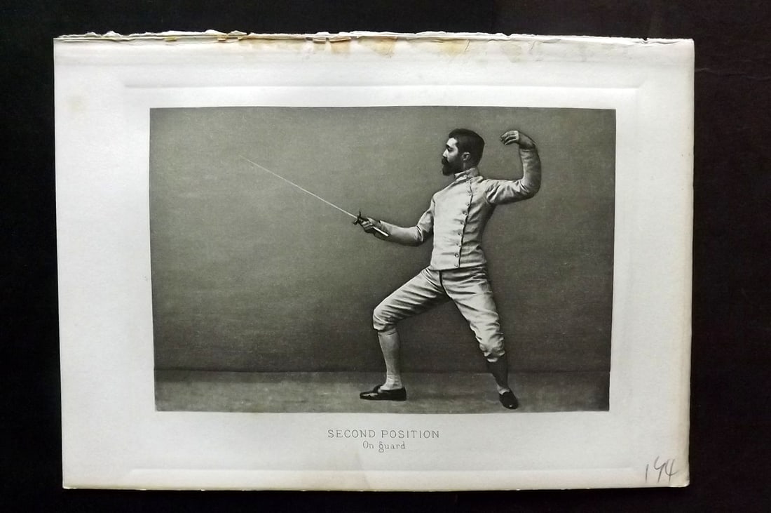 Badminton Library 1889 Antique Sword Fencing Print. Second Position - On Guard: Photogravure Published 1889, London for "The Badminton Library of Sports and Pastimes..." by Walter H. Pollock, E. B. Michell, and Walter Armstrong.Paper Size: 7.5 x 5 inch (19 x 13cm) Discrete Librar