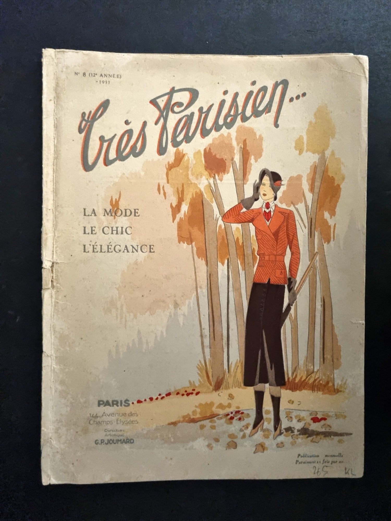 Tres Parisien 1931 Art Deco Pochoir Cover. Lady with Gun: Hand Colored Pochoir Lithograph Published 1920-34, Paris for "Tres Parisien" Edited by Germaine Joumard. Paper Size: 11 x 8 inch (28 x 21cm) Front and rear cover only (No contents/plates) Split on spi