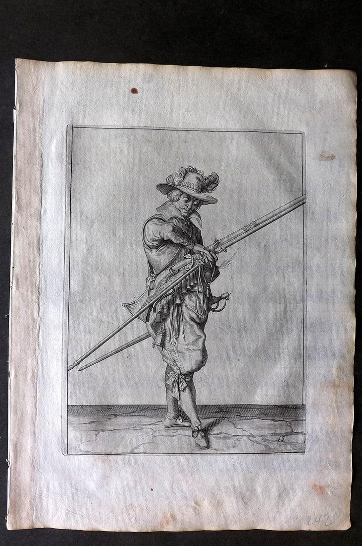 Gheyn, Jacob de 1608 Folio Military Print. Musketeer 15: Folio Copper Plate Published 1608, The Hague for "The Exercise of Arms, for Calivres, Muskettes and Pikes" by Jacob de Gheyn. Paper Size: 14 x 10 inch (36 x 25cm) Minor margin water stain. Good Condit
