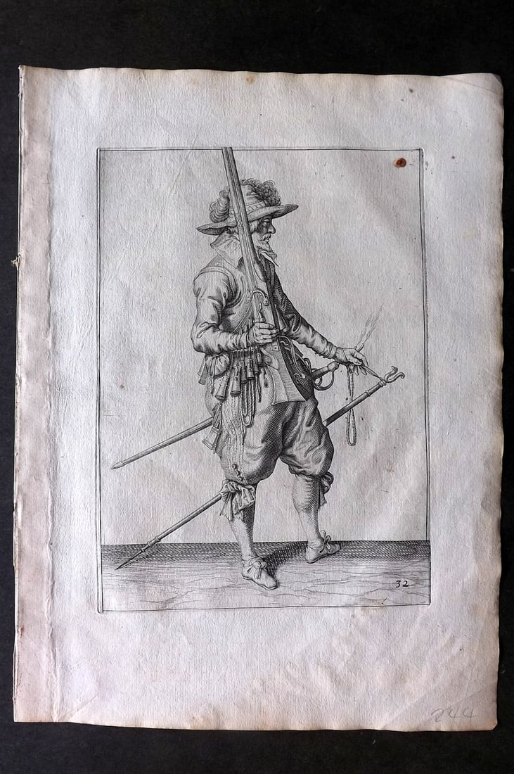 Gheyn, Jacob de 1608 Folio Military Print. Musketeer 32: Folio Copper Plate Published 1608, The Hague for "The Exercise of Arms, for Calivres, Muskettes and Pikes" by Jacob de Gheyn. Paper Size: 14 x 10 inch (36 x 25cm) Small tone spot at top. Good Conditio