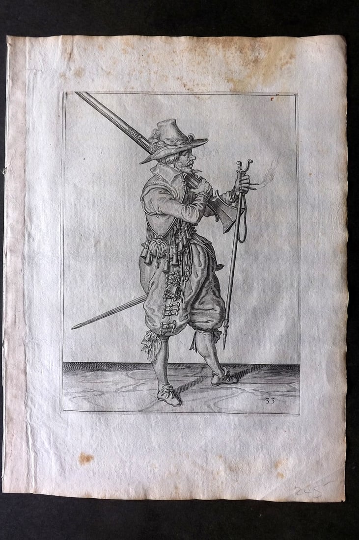 Gheyn, Jacob de 1608 Folio Military Print. Musketeer 33: Folio Copper Plate Published 1608, The Hague for "The Exercise of Arms, for Calivres, Muskettes and Pikes" by Jacob de Gheyn. Paper Size: 14 x 10 inch (36 x 25cm) Very minor margin toning. Good Condit