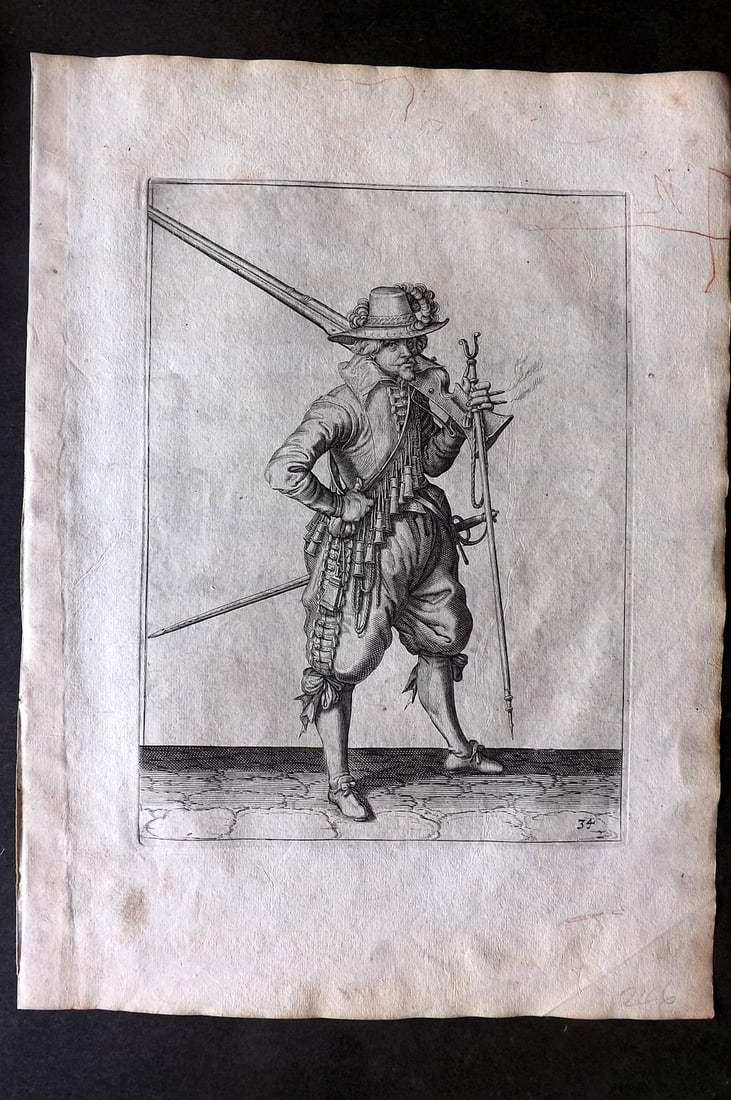 Gheyn, Jacob de 1608 Folio Military Print. Musketeer 34: Folio Copper Plate Published 1608, The Hague for "The Exercise of Arms, for Calivres, Muskettes and Pikes" by Jacob de Gheyn. Paper Size: 14 x 10 inch (36 x 25cm) A few light marks present. Good Condi