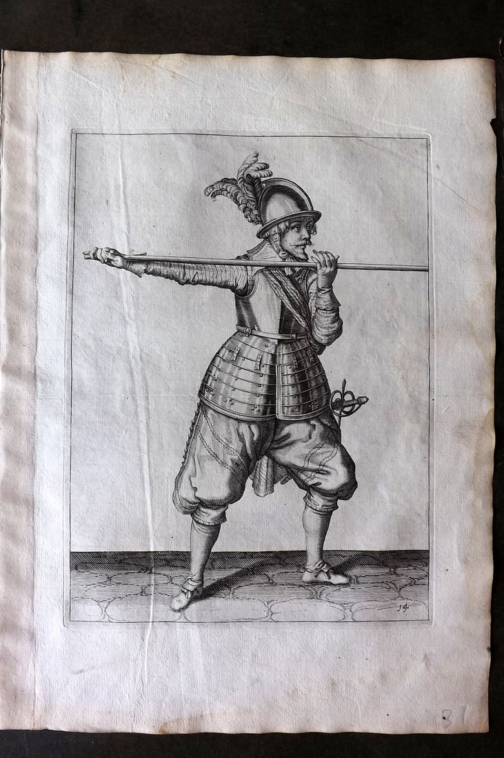 Gheyn, Jacob de 1608 Folio Military Print. Pikeman 14: Folio Copper Plate Published 1608, The Hague for "The Exercise of Arms, for Calivres, Muskettes and Pikes" by Jacob de Gheyn. Paper Size: 14 x 10 inch (36 x 25cm) Very minor margin water staining. Goo