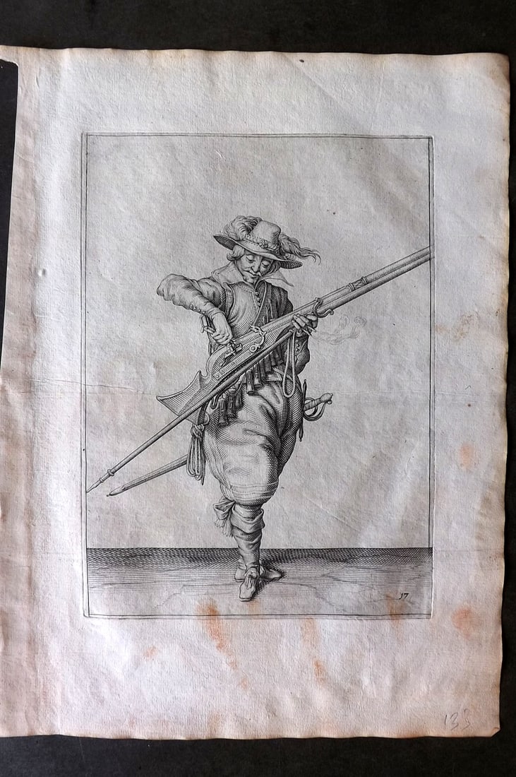 Gheyn, Jacob de 1608 Folio Military Print. Musketeer 17: Folio Copper Plate Published 1608, The Hague for "The Exercise of Arms, for Calivres, Muskettes and Pikes" by Jacob de Gheyn. Paper Size: 14 x 10 inch (36 x 25cm) Very minor staining. Good Condition