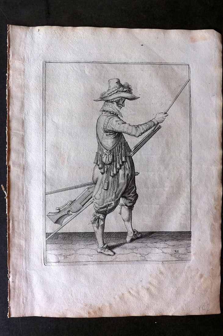 Gheyn, Jacob de 1608 Folio Military Print. Musketeer 30: Folio Copper Plate Published 1608, The Hague for "The Exercise of Arms, for Calivres, Muskettes and Pikes" by Jacob de Gheyn. Paper Size: 14 x 10 inch (36 x 25cm) Very minor margin water staining. Goo