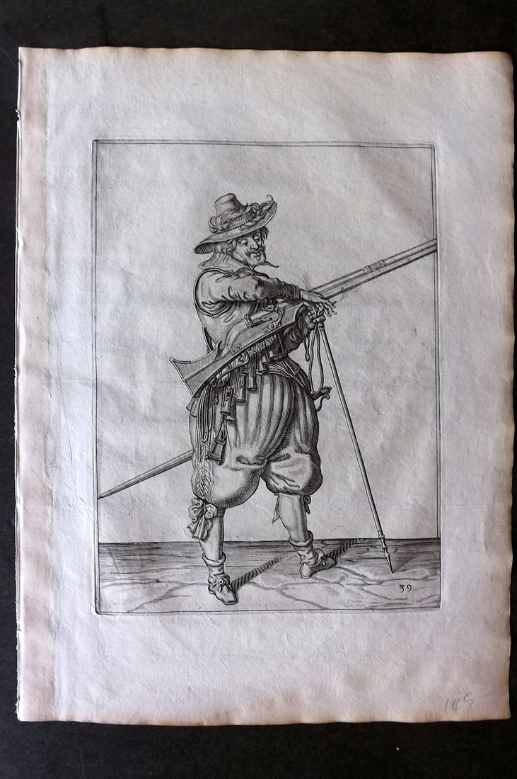 Gheyn, Jacob de 1608 Folio Military Print. Musketeer 39: Folio Copper Plate Published 1608, The Hague for "The Exercise of Arms, for Calivres, Muskettes and Pikes" by Jacob de Gheyn. Paper Size: 14 x 10 inch (36 x 25cm) Good Condition