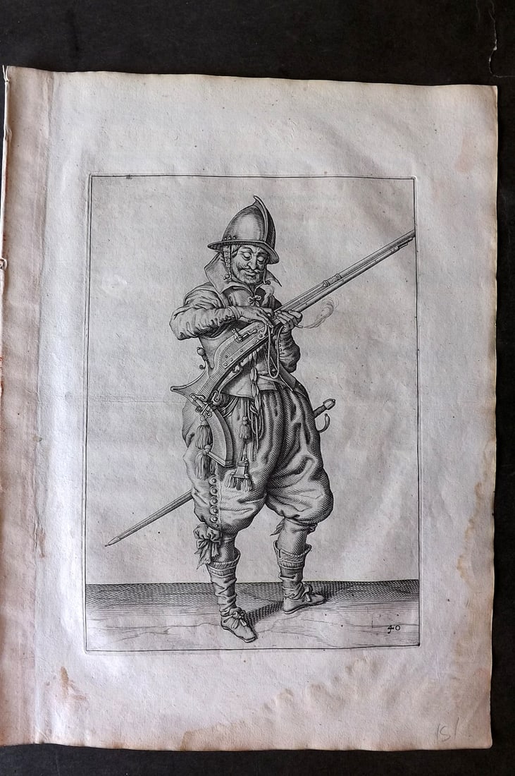 Gheyn, Jacob de 1608 Folio Military Print. Musketeer 40: Folio Copper Plate Published 1608, The Hague for "The Exercise of Arms, for Calivres, Muskettes and Pikes" by Jacob de Gheyn. Paper Size: 14 x 10 inch (36 x 25cm) Very minor margin water stain. Good C
