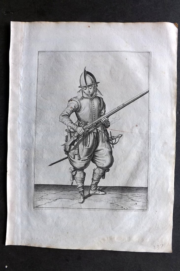 Gheyn, Jacob de 1608 Folio Military Print. Musketeer 18: Folio Copper Plate Published 1608, The Hague for "The Exercise of Arms, for Calivres, Muskettes and Pikes" by Jacob de Gheyn. Paper Size: 14 x 10 inch (36 x 25cm) A couple of tiny background marks. Go