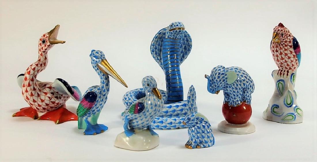 7 Herend Porcelain Fishnet Animal Figurines: HUNGARY, 20TH CENTURY A collection of seven Herend porcelain fishnet figures. The lot includes a cobra, duck, elephant, owl, parrot, pelican, and rabbit. Dimensions: Largest measures approx 4 1/2" tal
