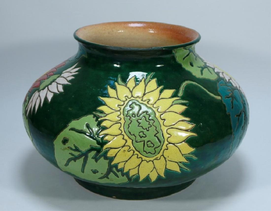 LG Japanese Pottery Floral Sunflower Squat Vase: JAPAN, EARLY 20TH CENTURY A large Japanese pottery floral squat vase. The vase is finished in a green high glaze with incised leaves and sunflowers in polychrome enamel. The underside bears an impress